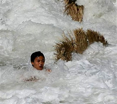 A boy gets swept away by the tsunami in Thailand