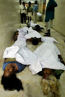 The dead are temporarily placed on the floor of a morgue